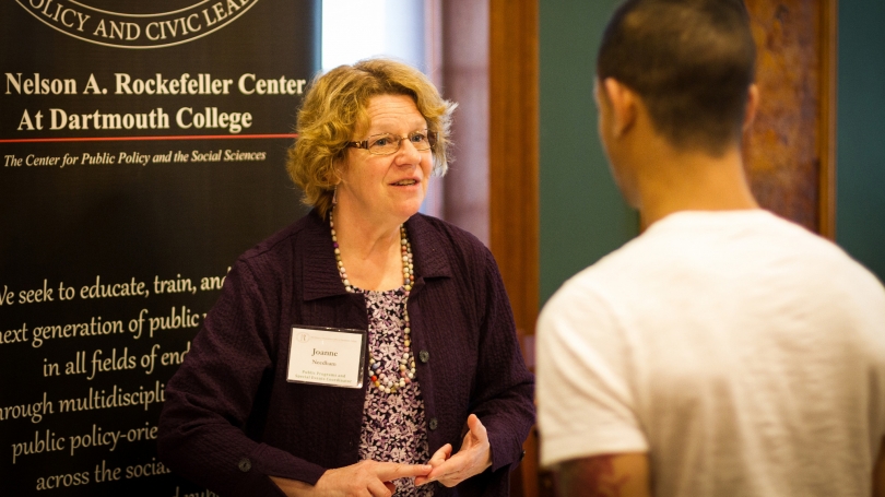 Joanna Needham speaks with a student about the Rockefeller Center at the spring job fair