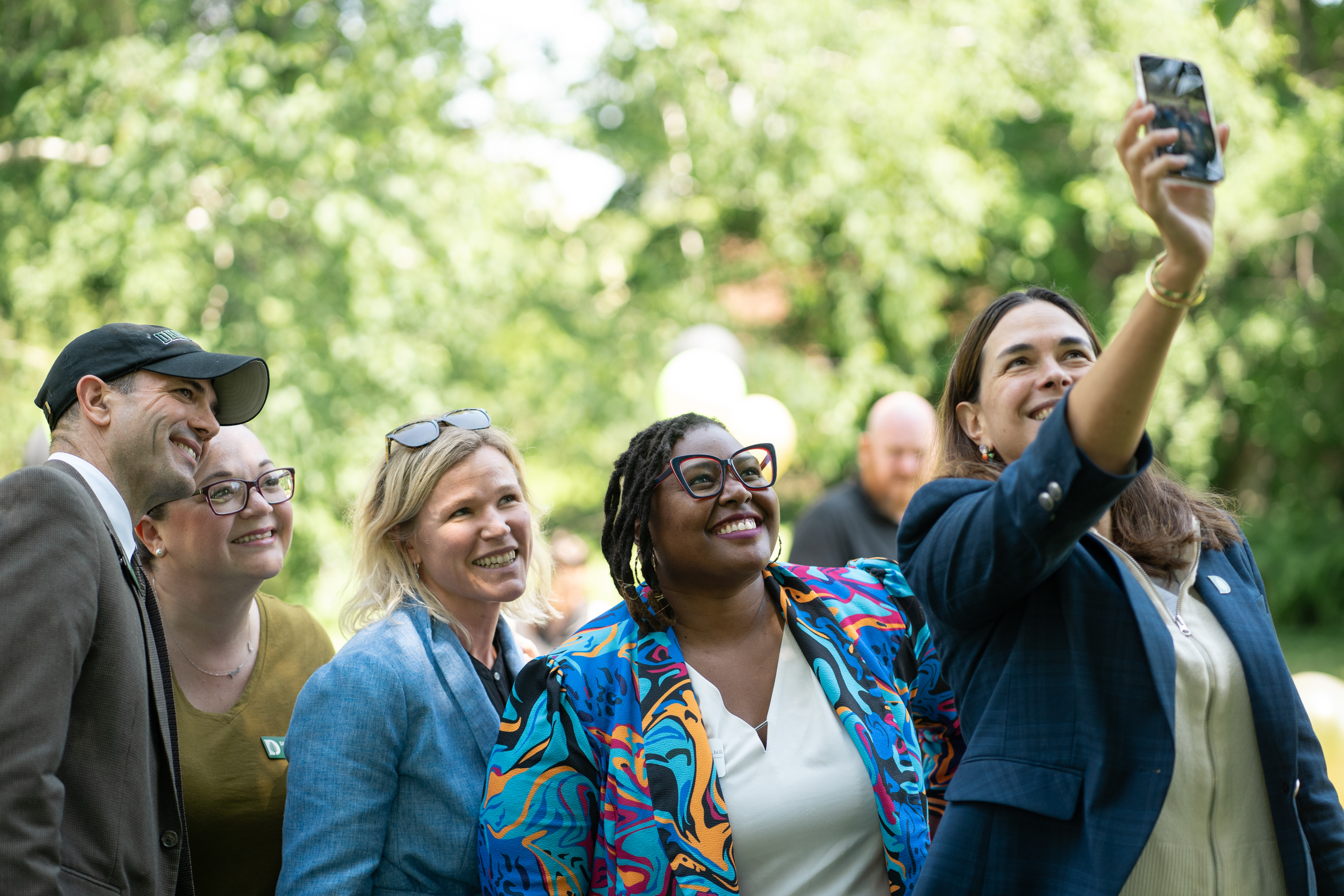 Sian Leah Beilock takes a selfie with Juneteenth luncheon attendees