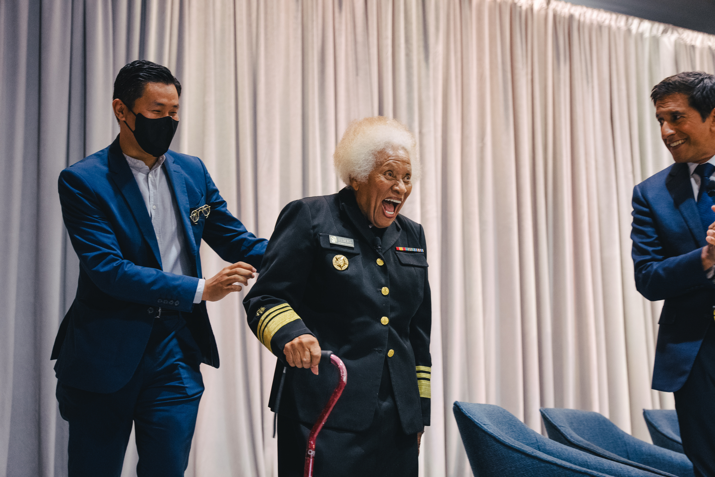 Joycelyn Elders smiling onstage