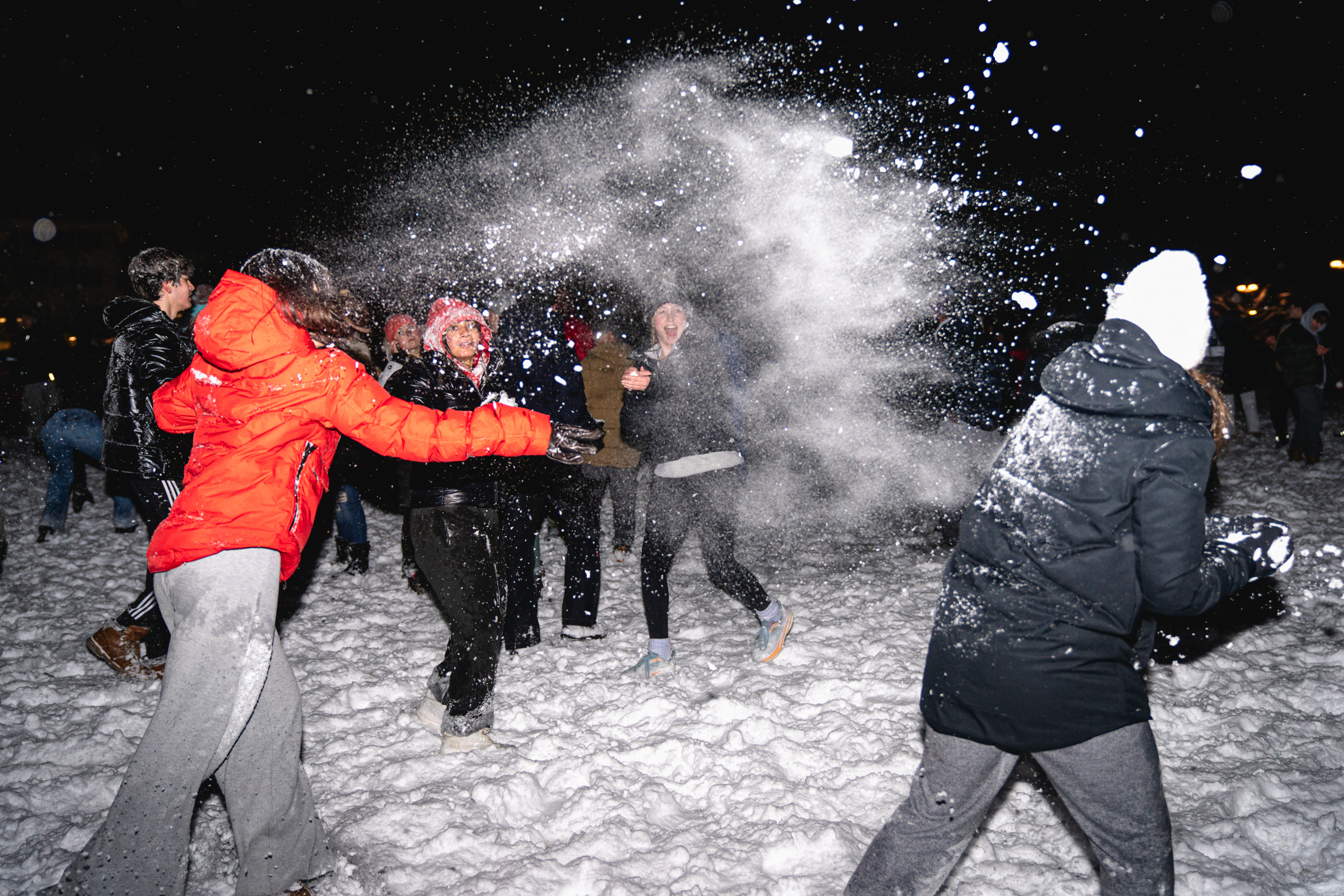Students play in the snow