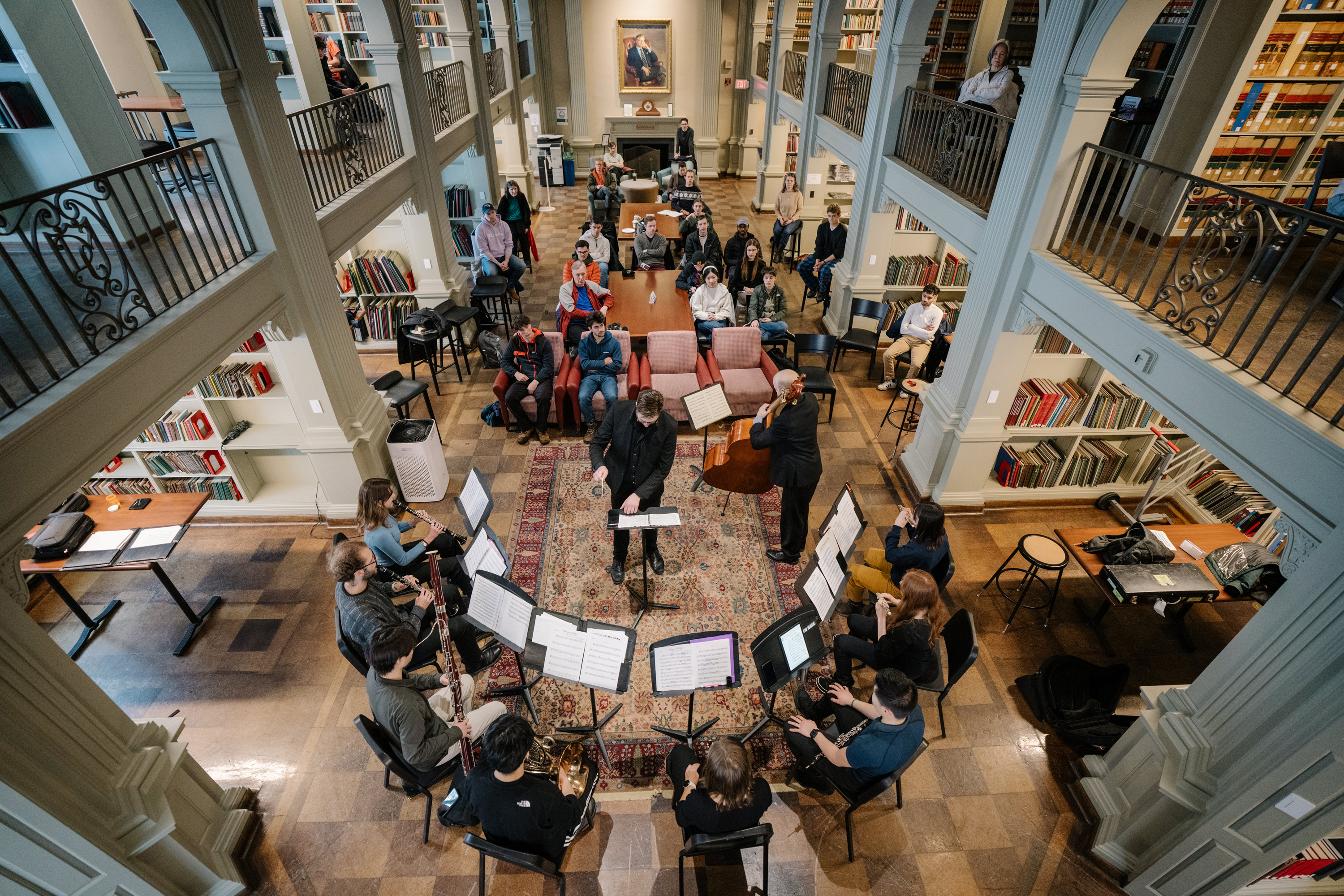 U.S. Navy Band principal bassist Kyle Augustine and double bass faculty Nick Browne with student musicians.
