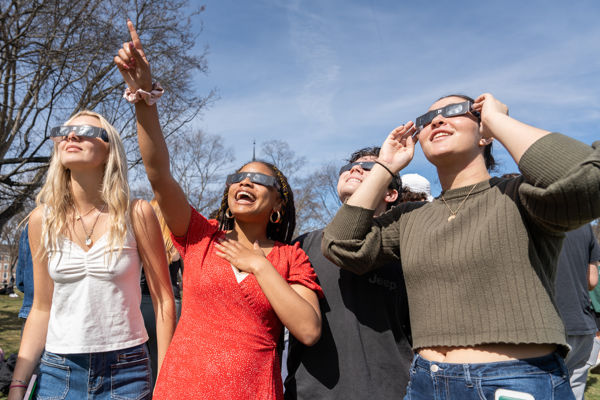 People watch the solar eclipse with special glasses
