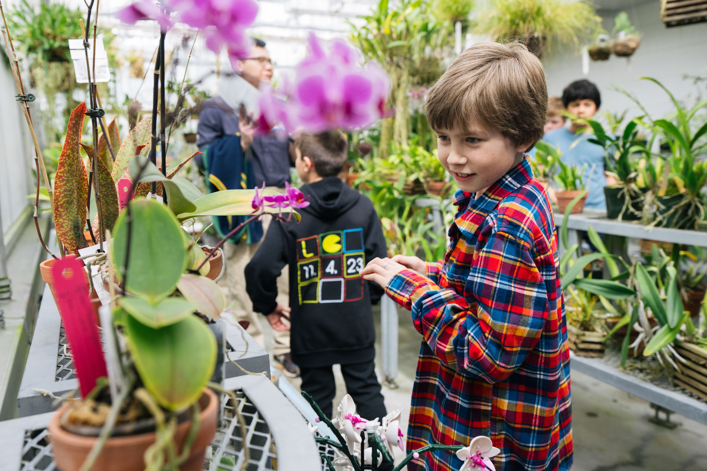 Ave Gough looking at plants in the Green House