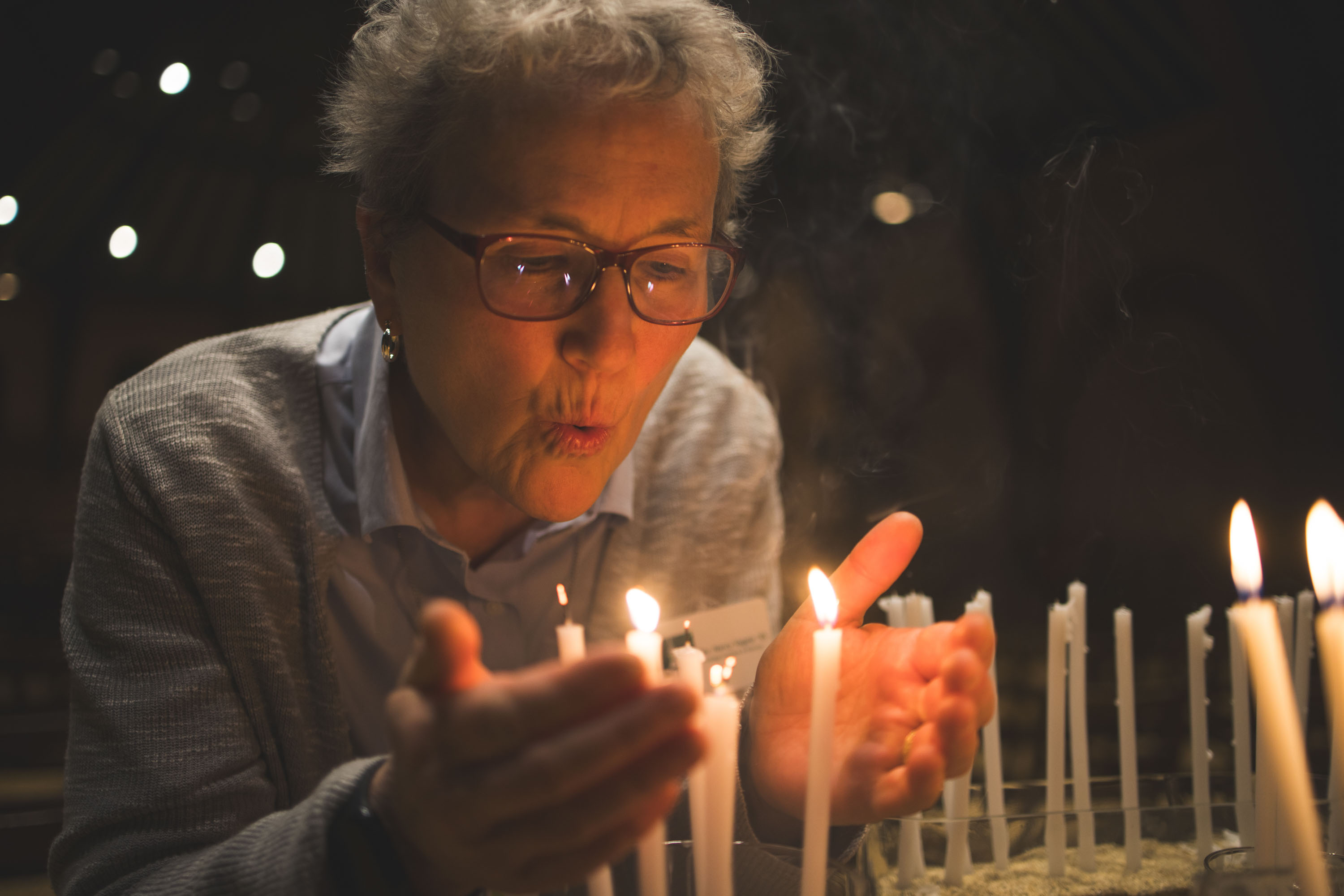 Nancy Vogele blows out candles
