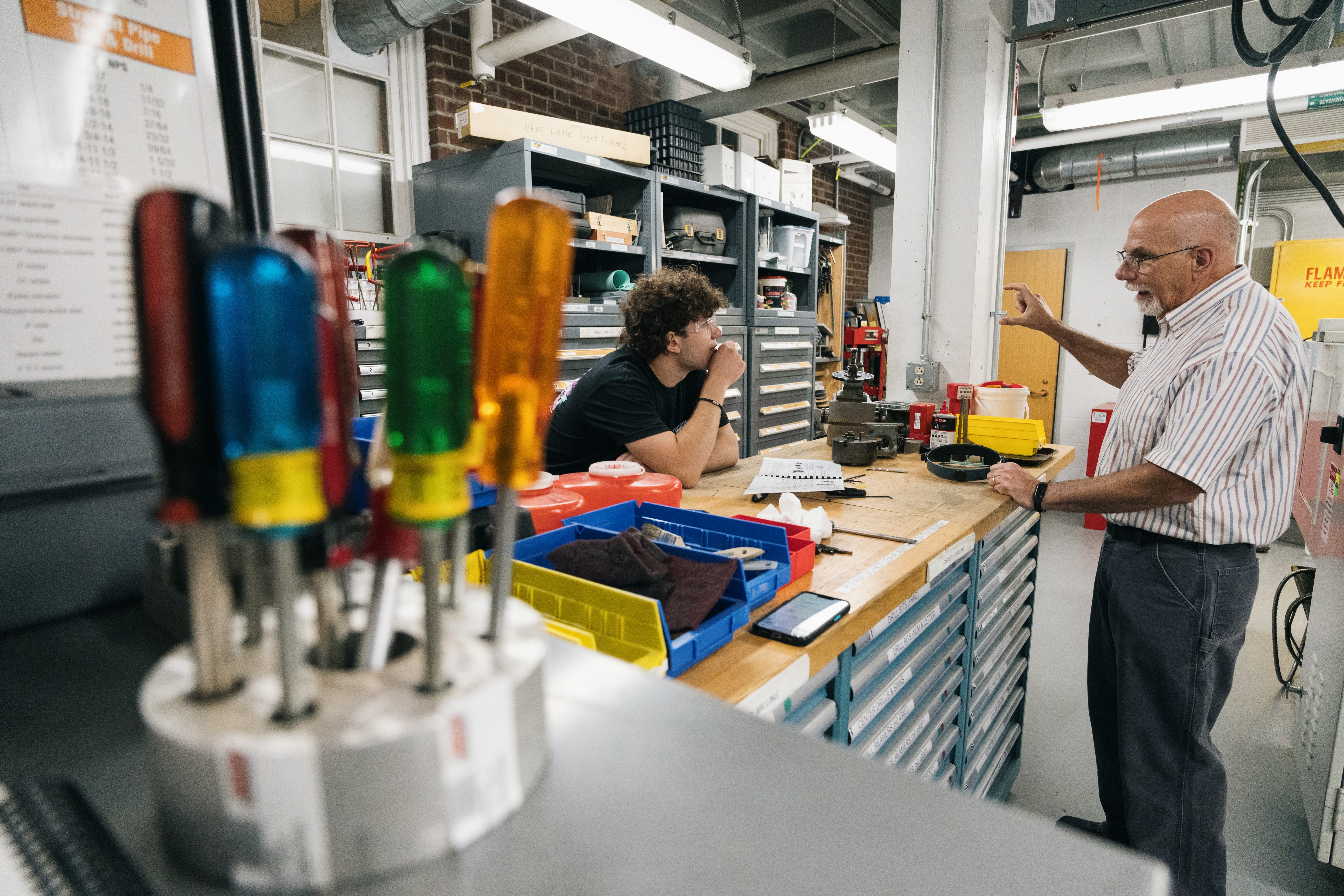 Matteo Corrado and Joe Poissant in the machine shop