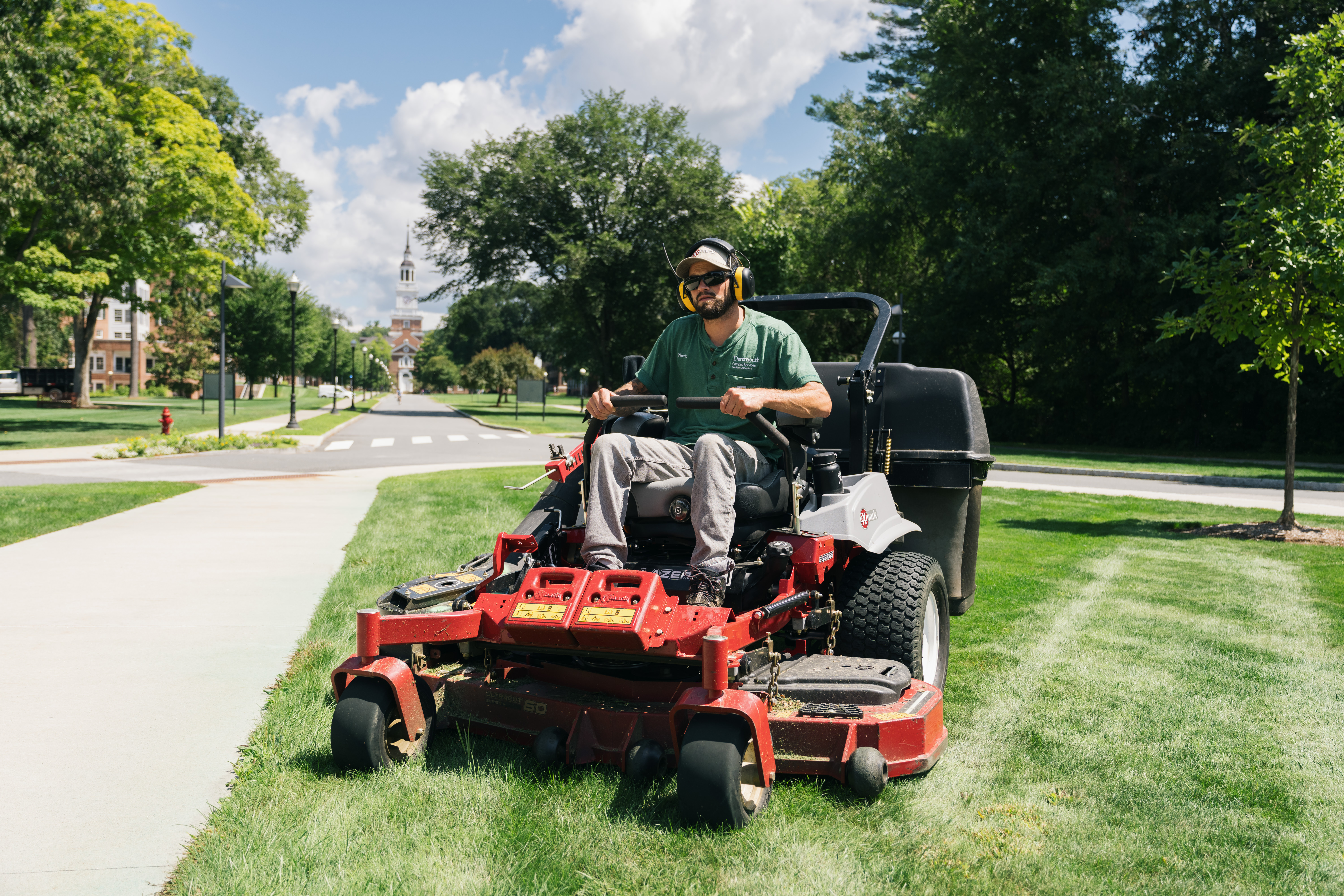 Kevin Niboly driving a lawn mower