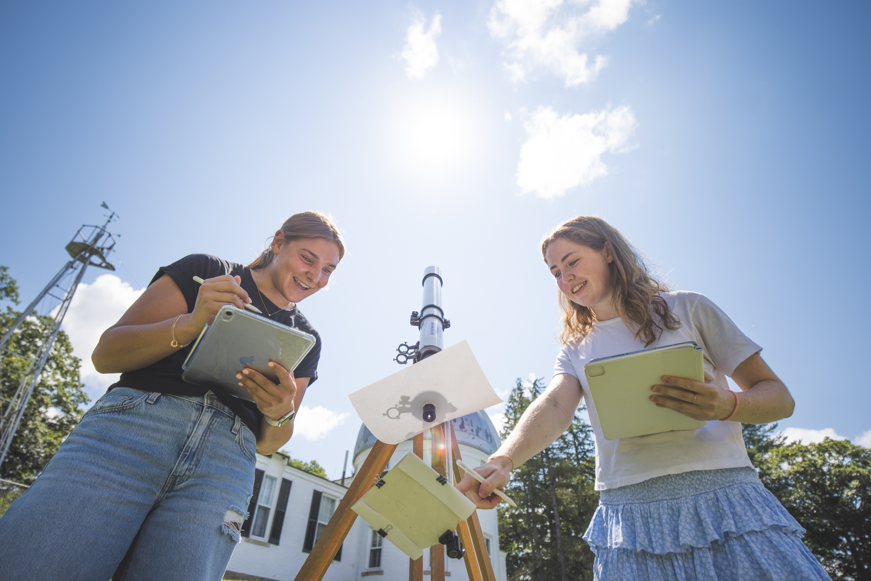 Students studying the sun's shadow