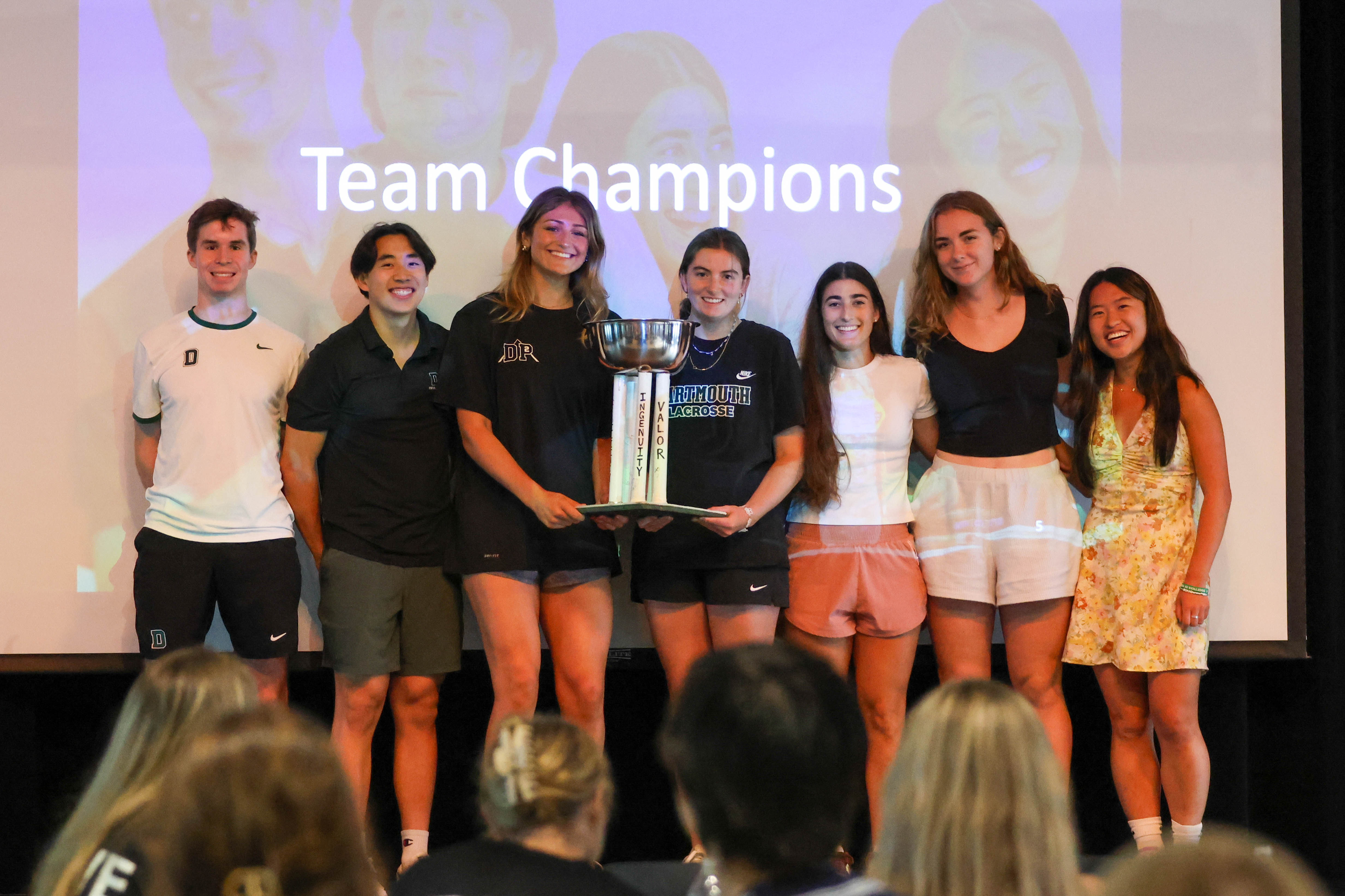 Dartmouth athletes hold a trophy