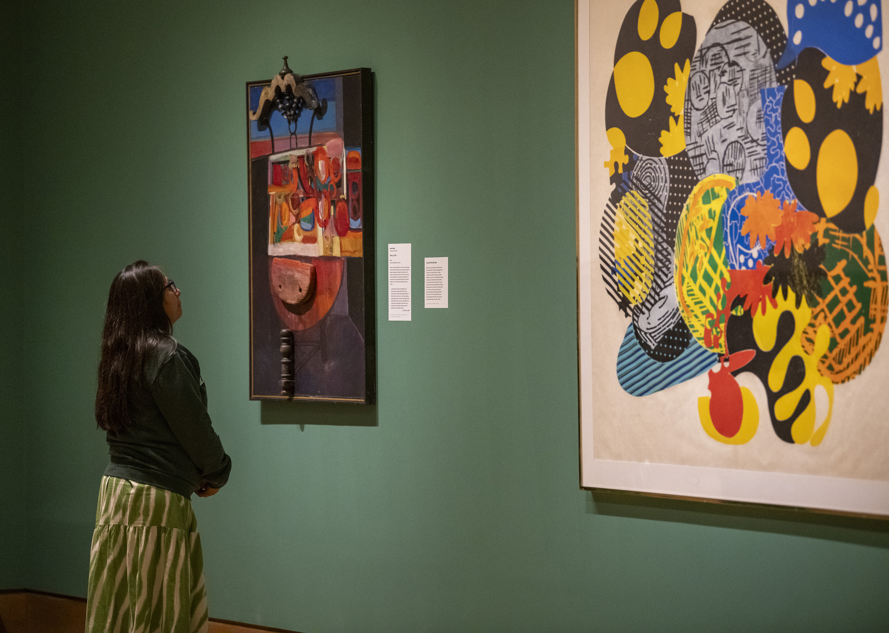 A person looks at art in the Dartmouth Hood Museum