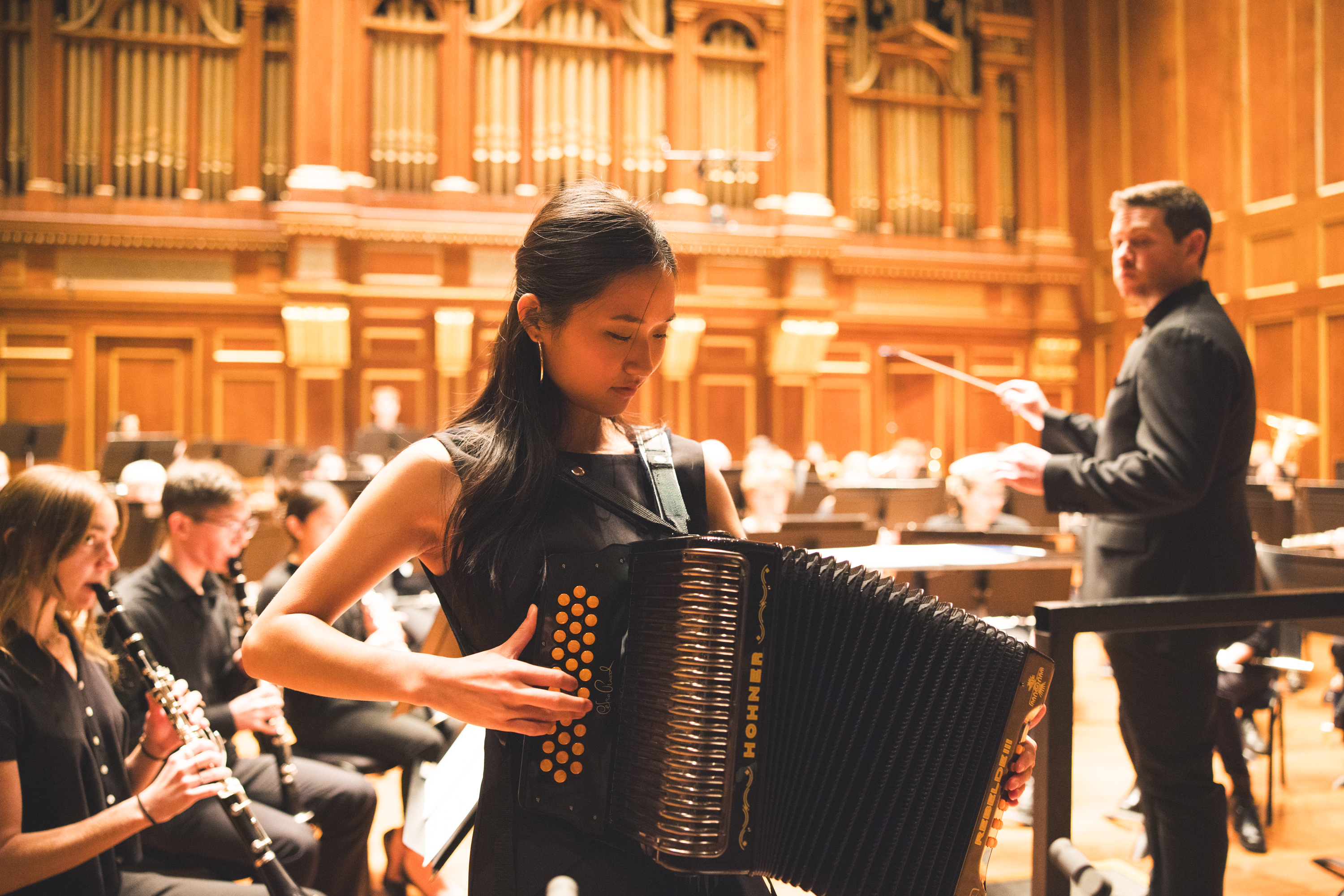 Woman from the Wind Ensemble playing accordian