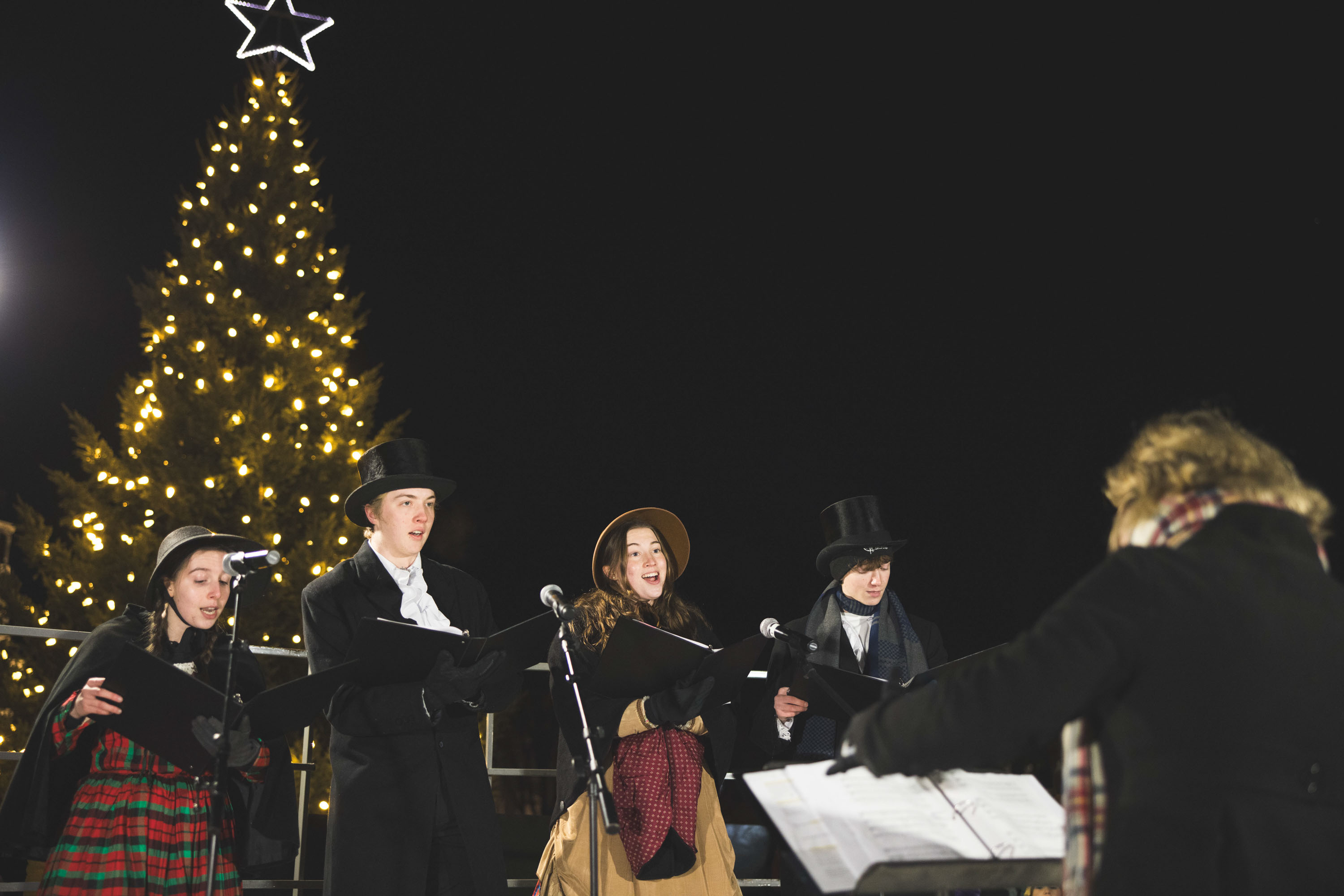 Singers in front of the Christmas tree