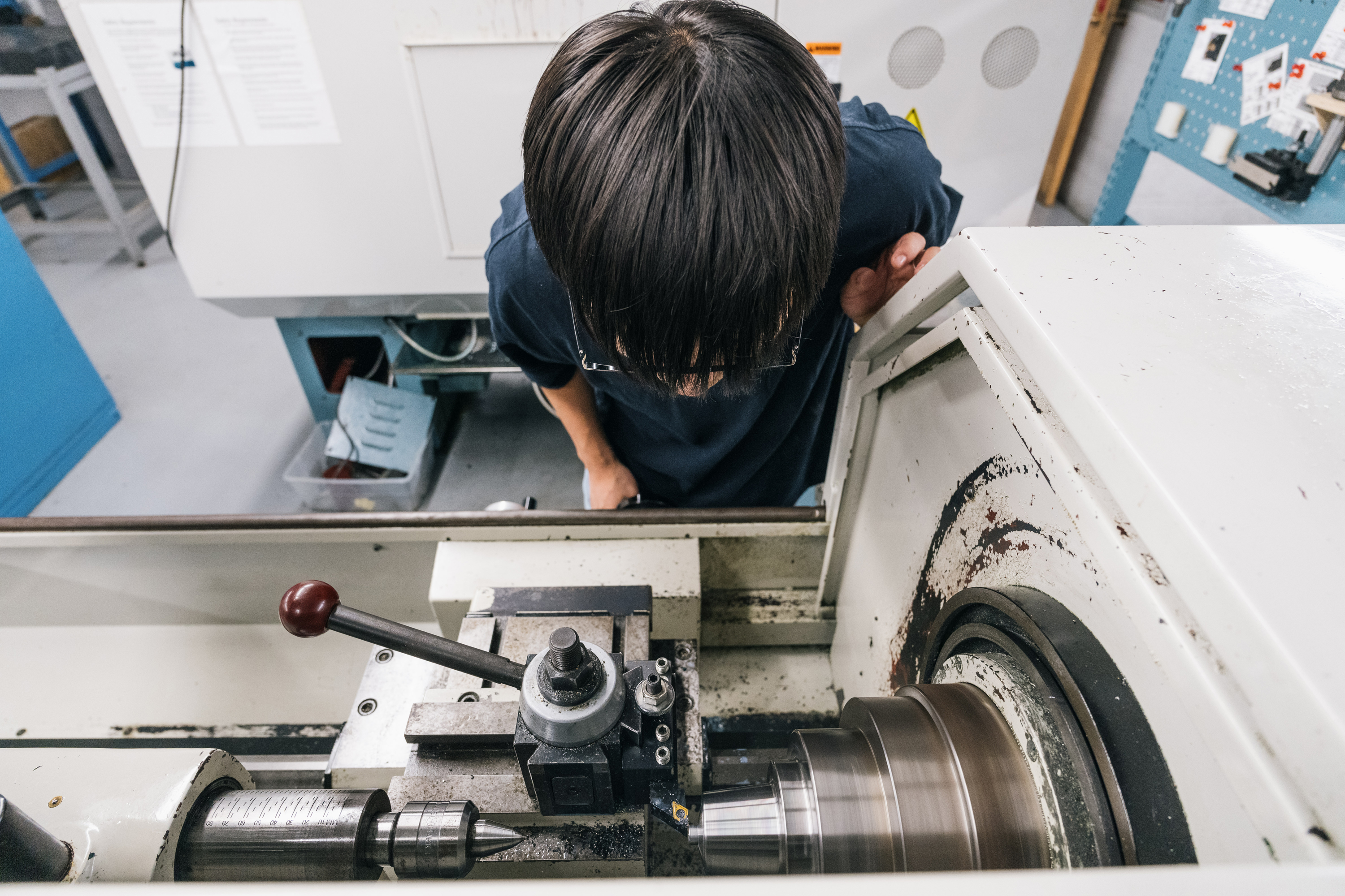 Daniel Jeon working on a lathe