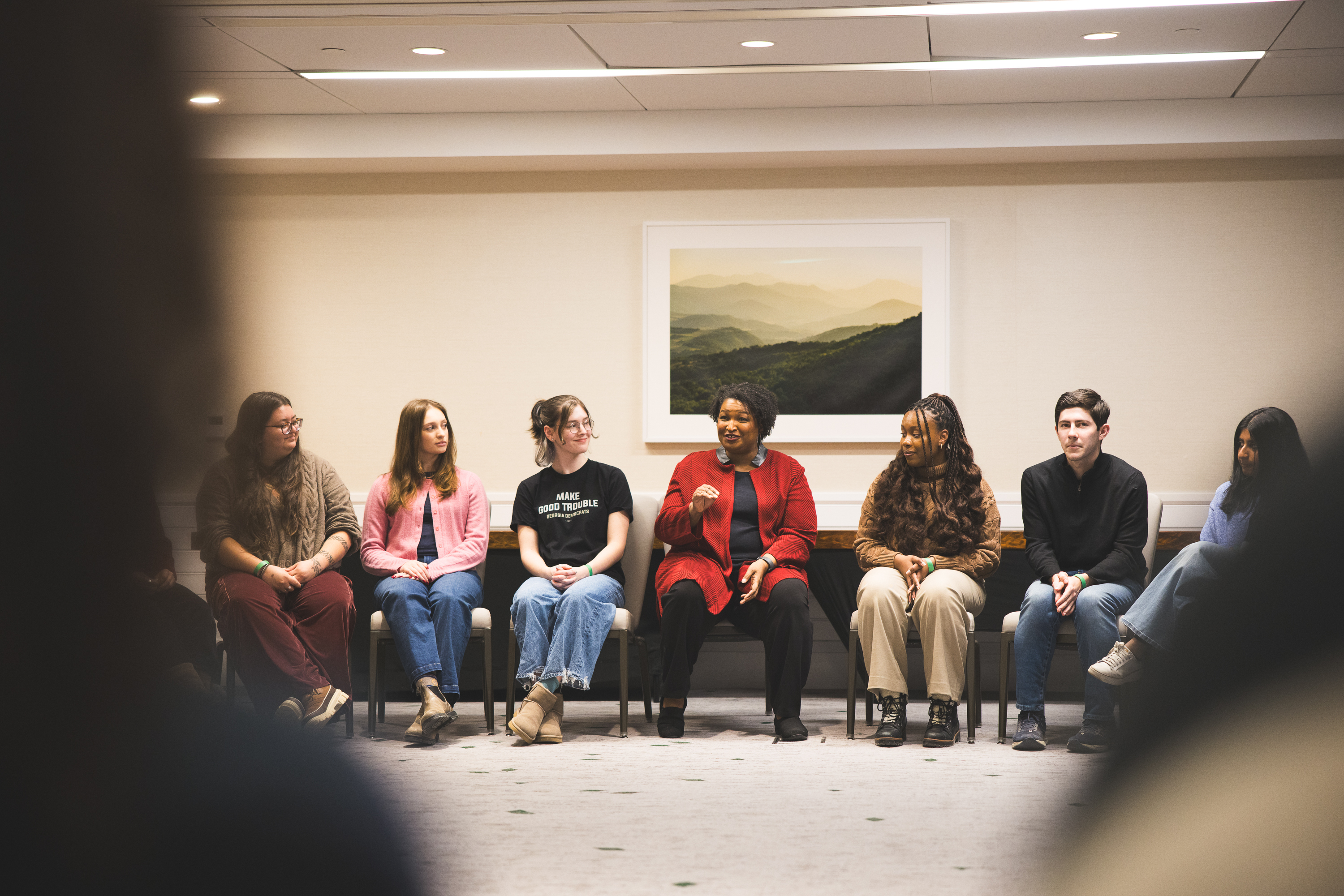 Stacey Abrams sitting amongst students