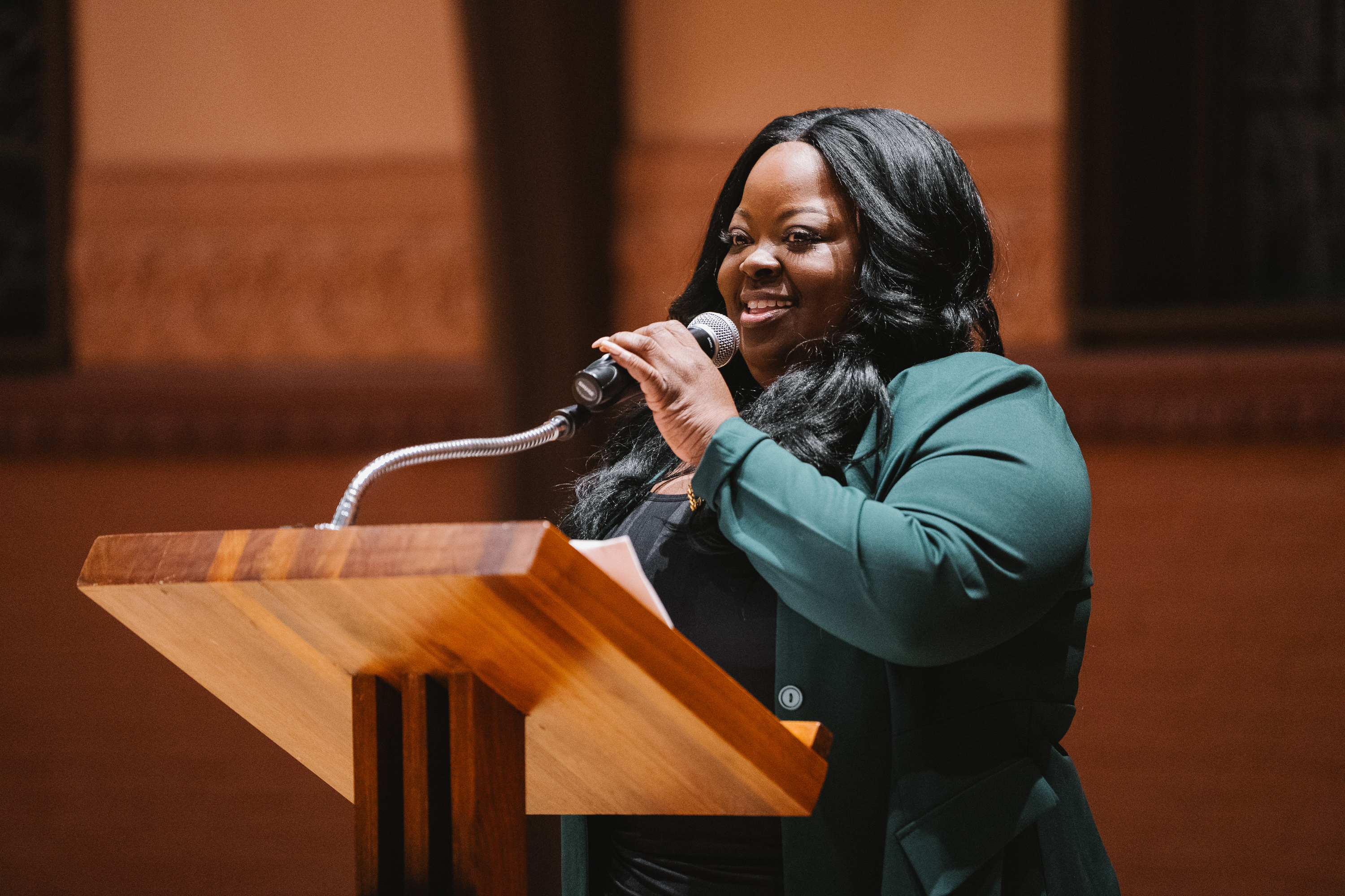 Dr. La-Tarri Canty giving the main address at a podium