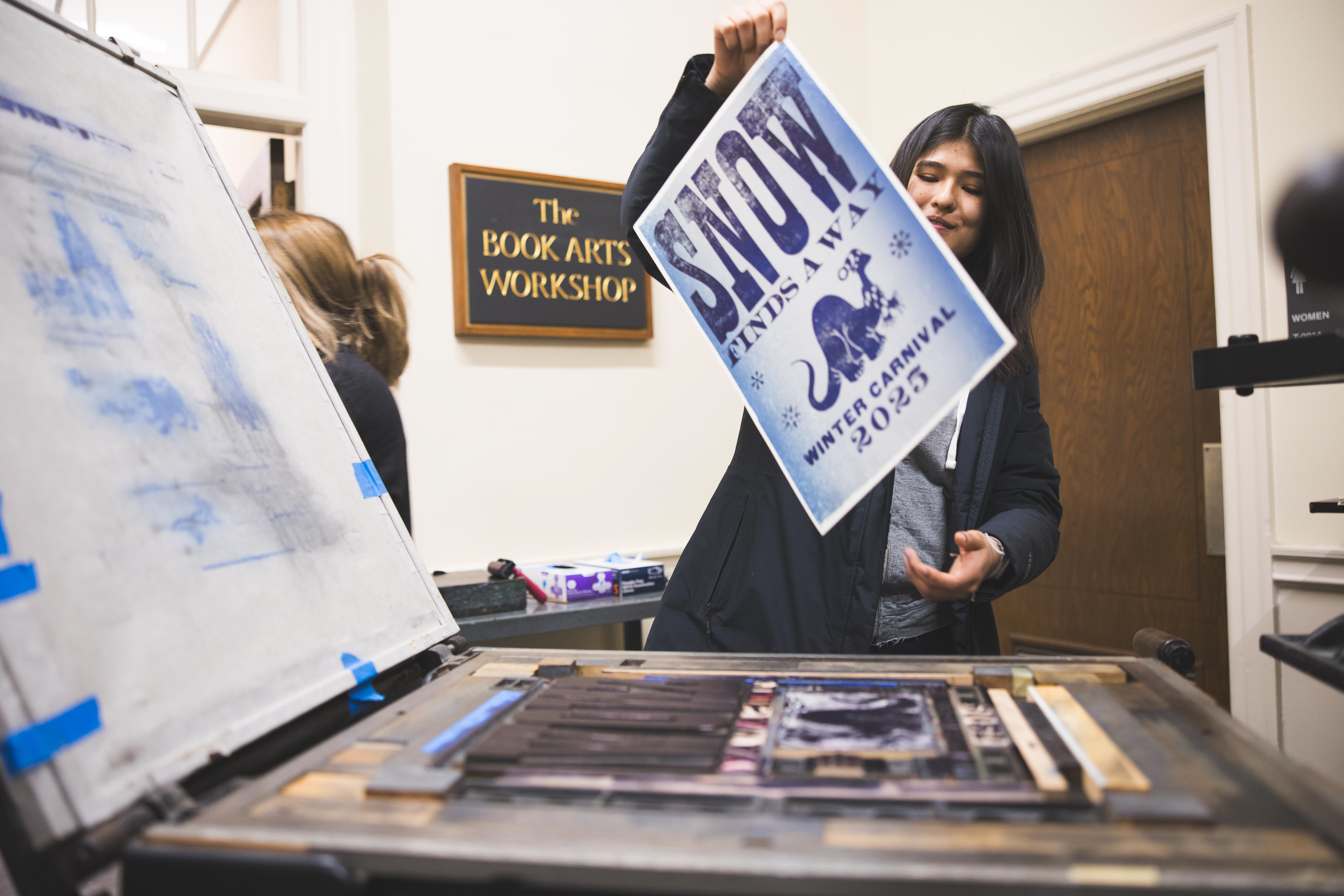 Hannah Madrigal holding her printed poster