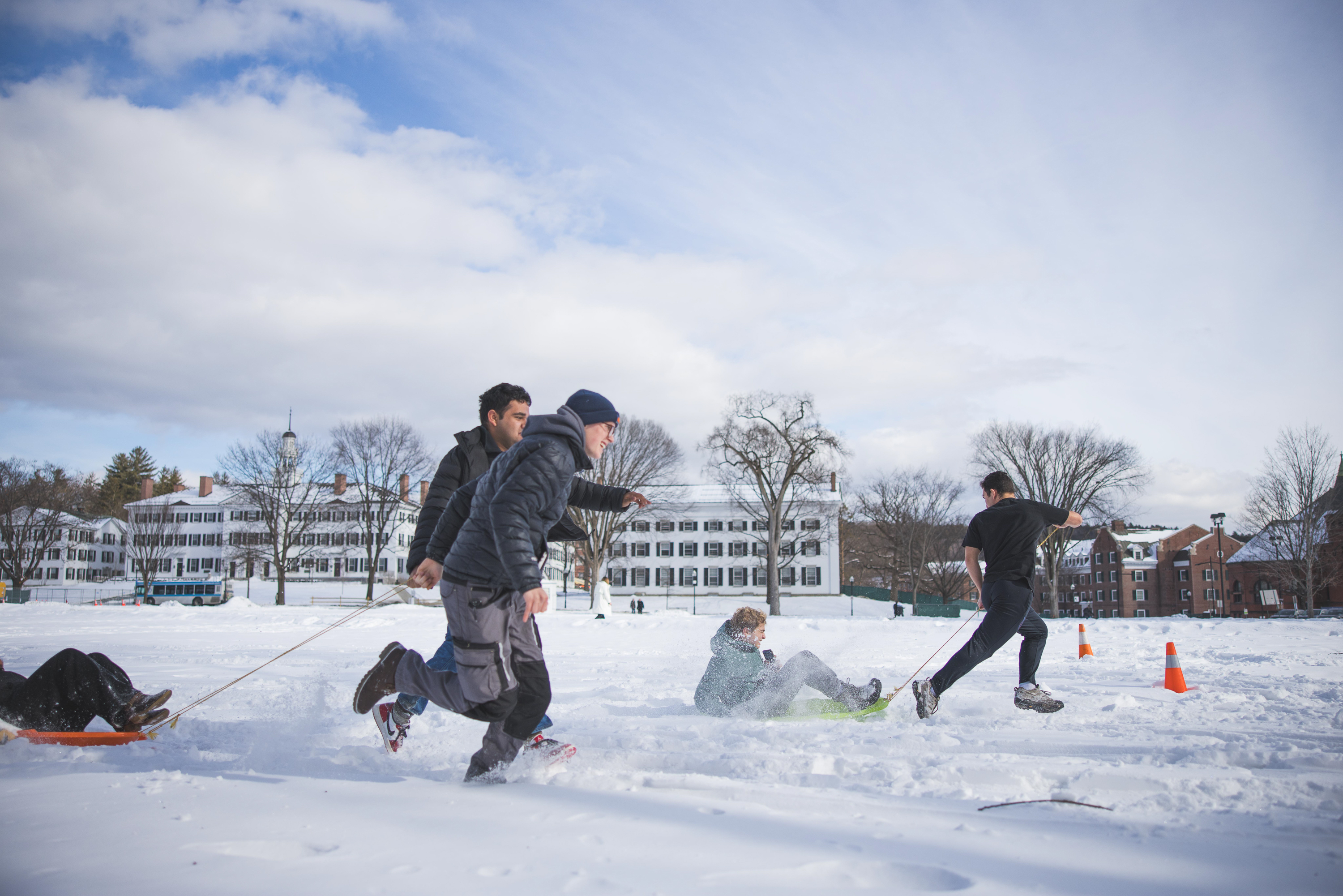 Students doing a relay race in the snow