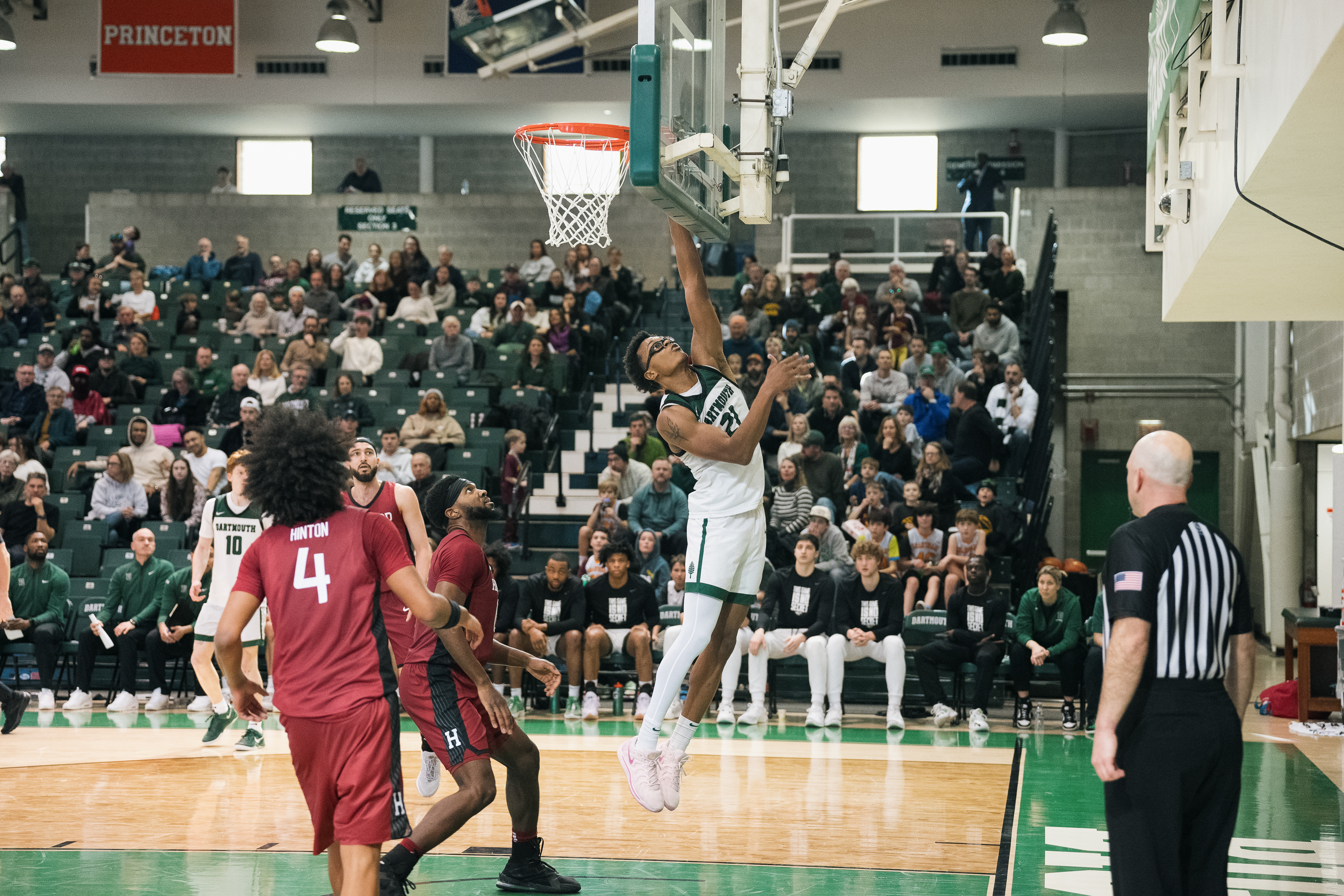 Dartmouth basketball player dunking on Harvard