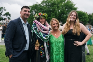 A family poses for a picture during commencement.