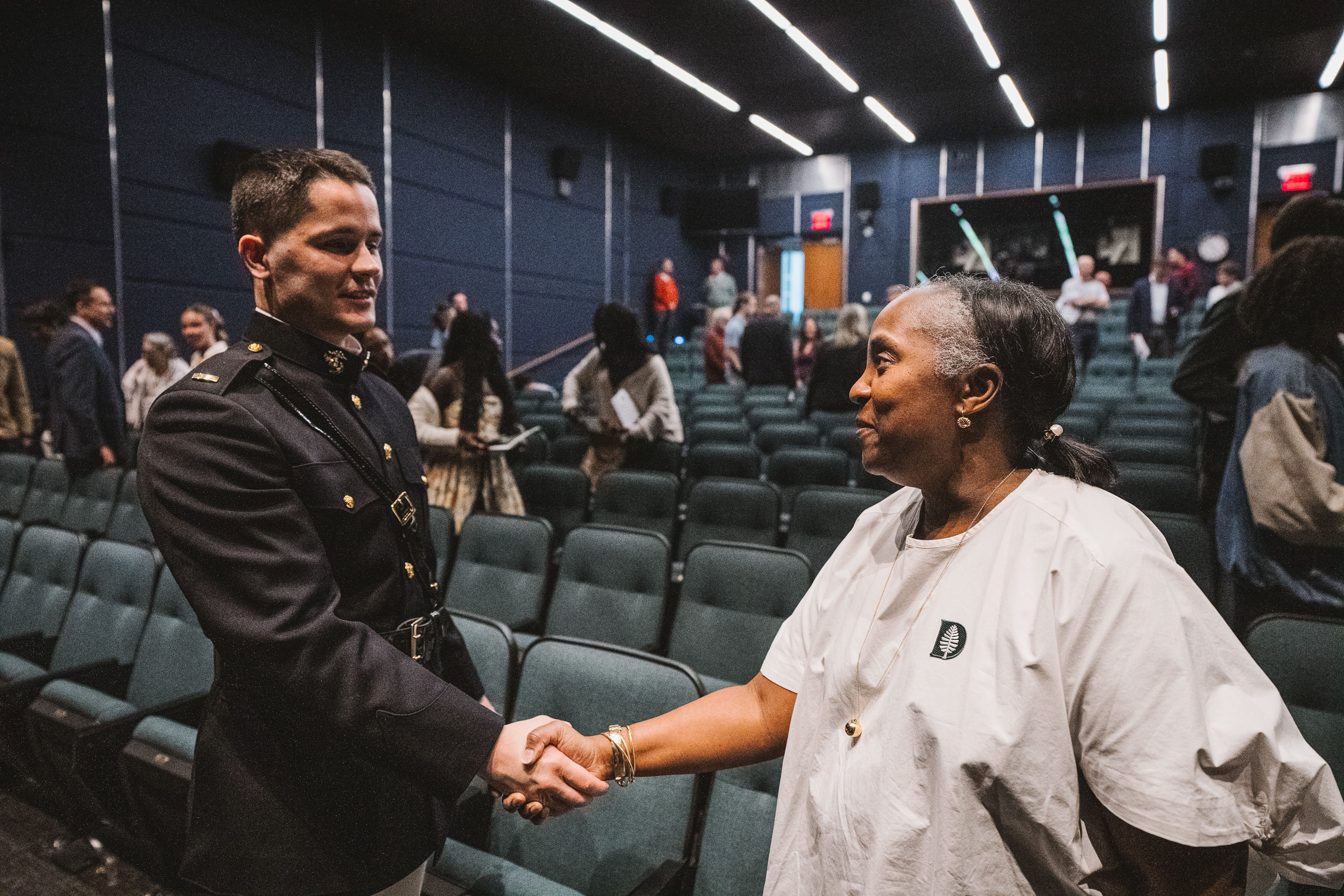Justin Paré shaking Odette Harris' hand