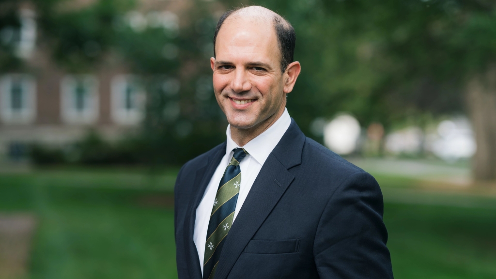 Portrait of Scott Brown, blue blazer, green/blue striped tie