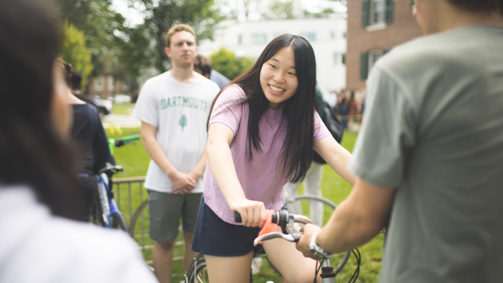 Incoming student tries out a bicycle