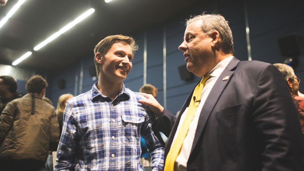 Former N.J. Gov. Chris Christie with a student