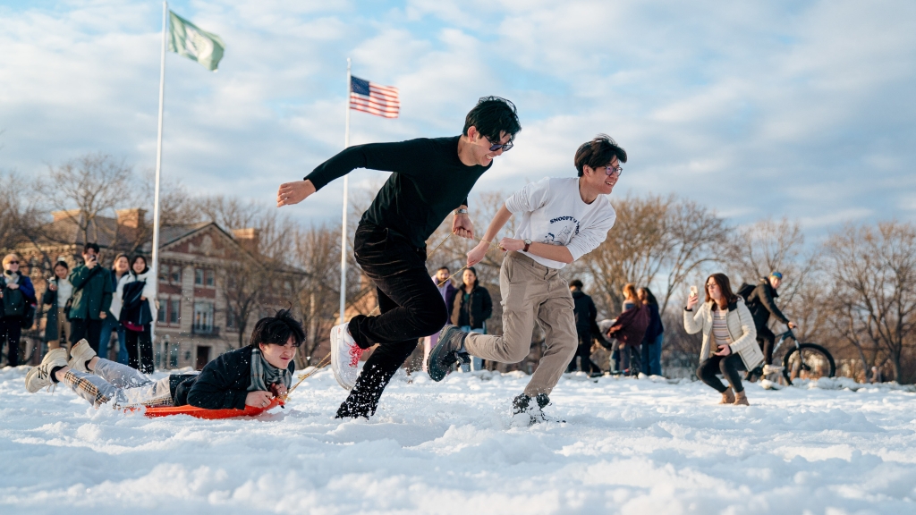 Students drag classmates on sleds