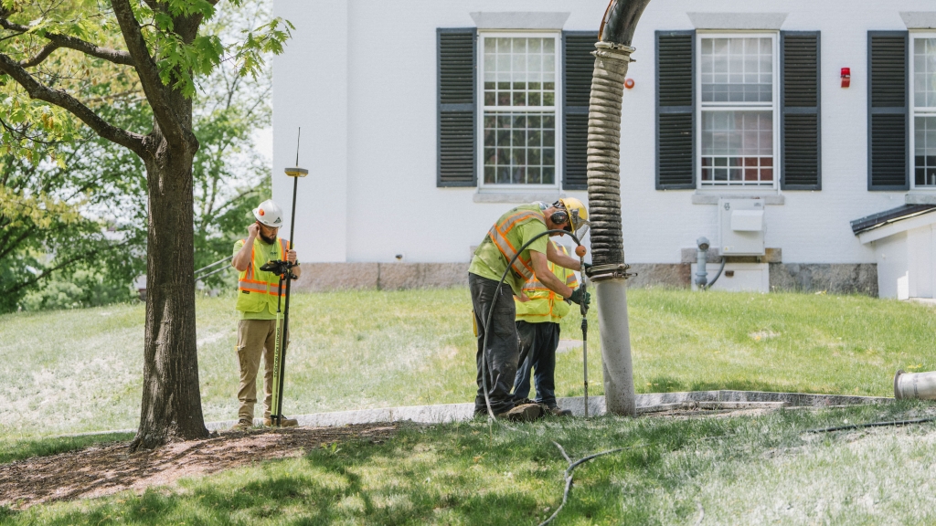 R.H. White employees surveying underground utilities