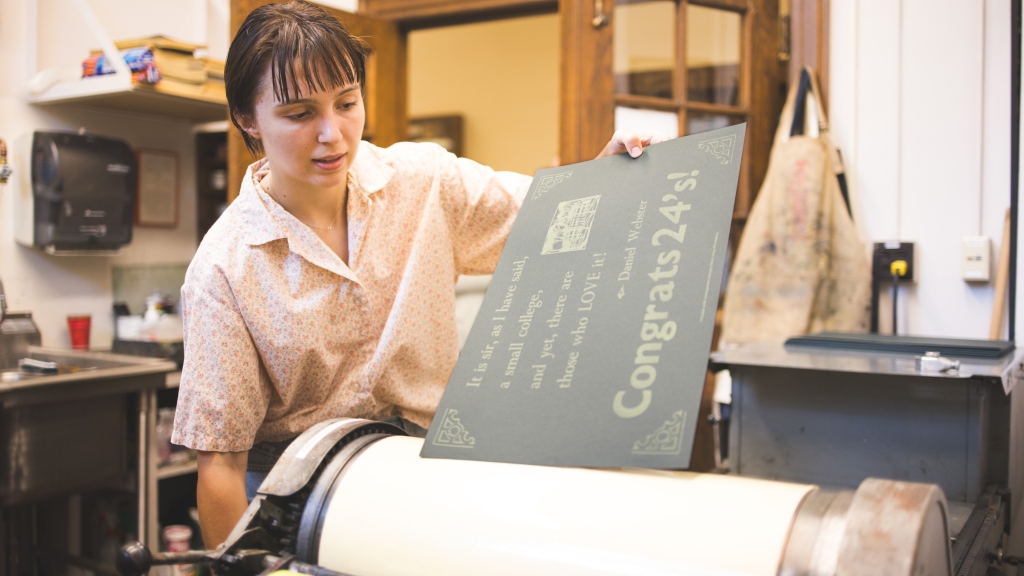 Yuliya Subotskaya rolling a poster