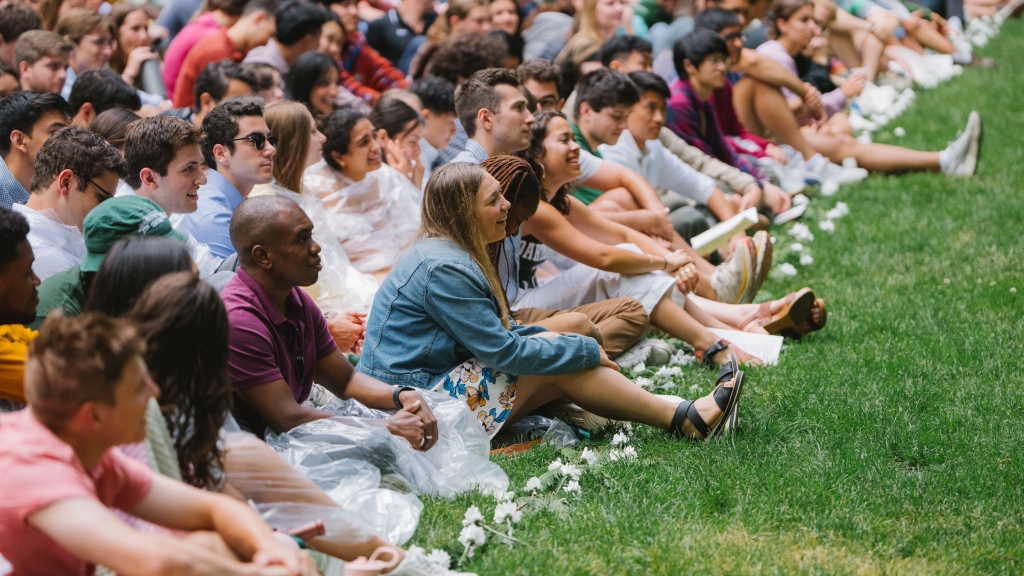 Students sitting in the grass