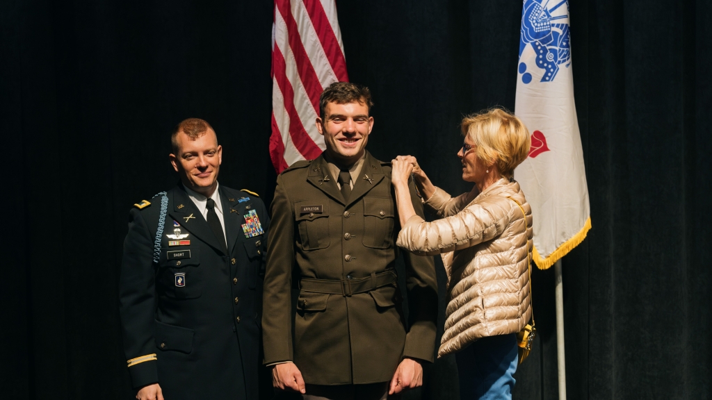 Sara Appleton pins second lieutenant bars on her son David