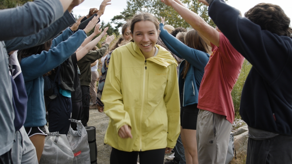 Student walking towards camera