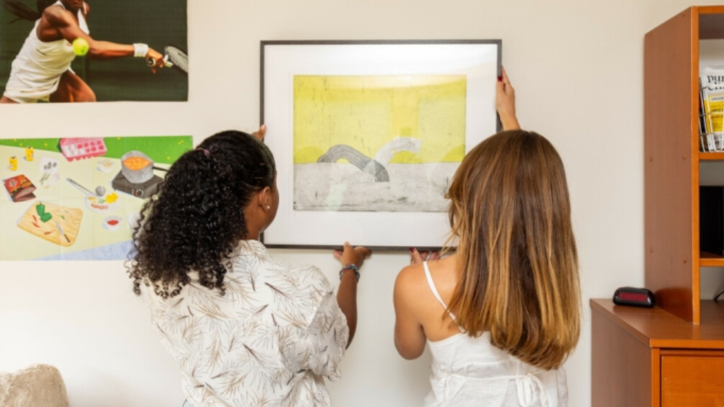 Students hanging a picture