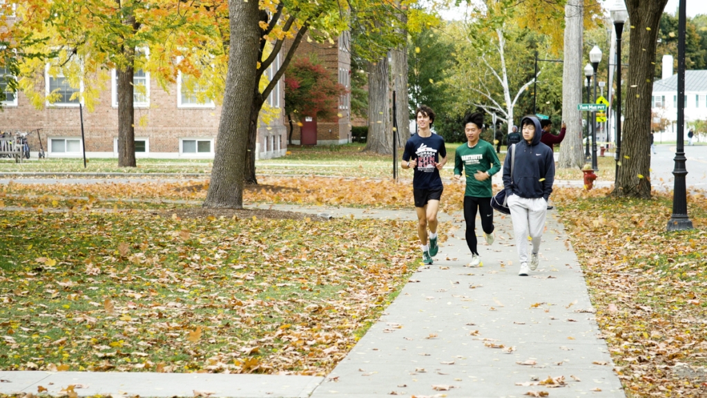 Students running on campus