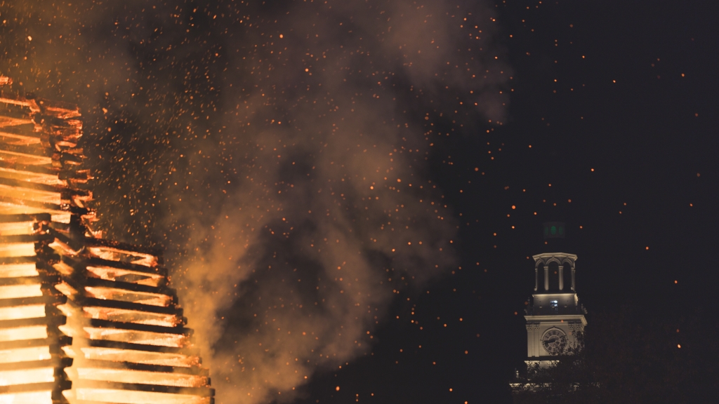 Lit bonfire in front of baker tower