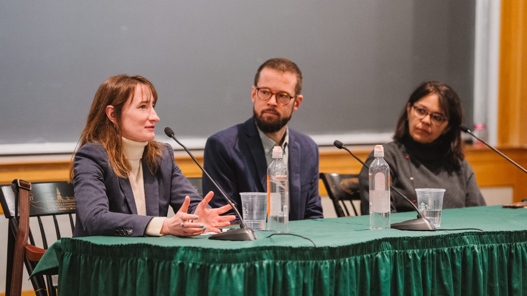 Panelists Ieva Jusionyte, Adam Goodman, and Cecilia Menjívar discuss amongst eachother