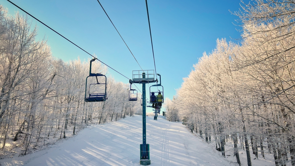 Two-person chairlift in the snow