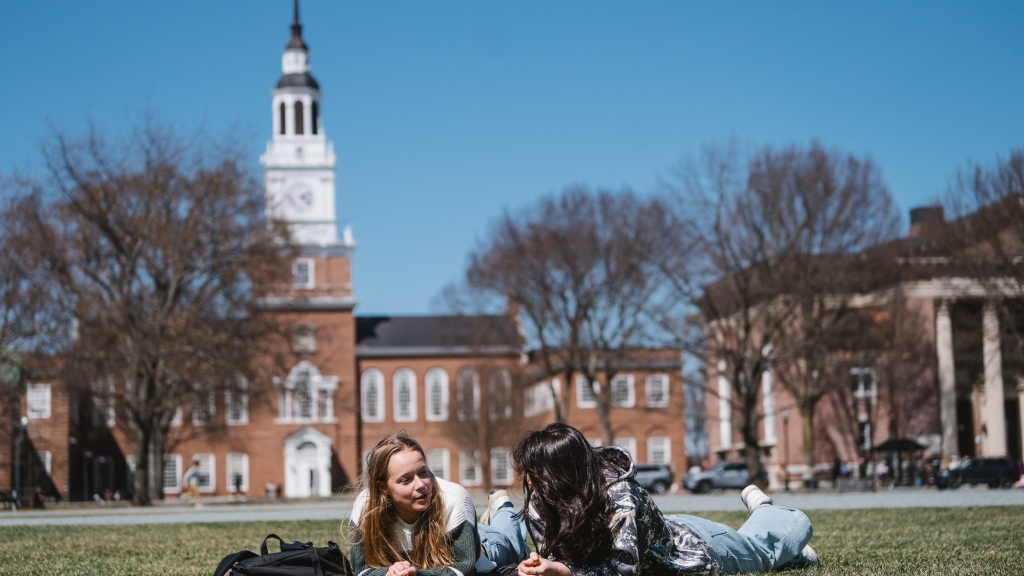 Sadie Butler and Ciara McCrory lying on the Green